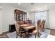 Formal dining room with elegant furniture, hardwood floors, and natural light at 5032 W Yearling Rd, Phoenix, AZ 85083
