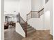 Entryway boasting an open floor plan, wooden staircase with iron spindles, and views into the living areas at 5032 W Yearling Rd, Phoenix, AZ 85083