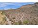 Scenic aerial view of desert landscape with a walking trail, ideal for outdoor activities at 5032 W Yearling Rd, Phoenix, AZ 85083