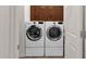 Convenient laundry area with modern washer and dryer, plus ample cabinet space at 5032 W Yearling Rd, Phoenix, AZ 85083