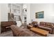 Spacious living room showcases a staircase, piano, and comfortable leather furniture at 5032 W Yearling Rd, Phoenix, AZ 85083
