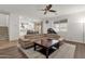 Open-concept living room with hardwood floors, modern furnishings, and natural light at 5032 W Yearling Rd, Phoenix, AZ 85083