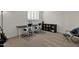This office is staged with two desks, chairs, a bookshelf and has a comfortable chair and ottoman in the corner at 5032 W Yearling Rd, Phoenix, AZ 85083