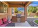 Outdoor kitchen featuring a built-in grill, perfect for entertaining at 5032 W Yearling Rd, Phoenix, AZ 85083