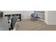 Upstairs room features neutral carpet, white walls, and is currently staged as an open seating space at 5032 W Yearling Rd, Phoenix, AZ 85083