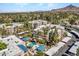 Aerial view of a multi-building complex featuring well-maintained landscaping and a community pool with covered seating at 5124 N 31St Pl # 536, Phoenix, AZ 85016