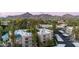 Rooftop aerial showing community, a golf course, and mountain views in the distance at 5124 N 31St Pl # 536, Phoenix, AZ 85016