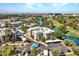 Aerial view of community on the water, manicured lawns, shaded parking, blue roofs, and mature trees at 5124 N 31St Pl # 536, Phoenix, AZ 85016
