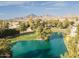 Scenic aerial view of a lush golf course community with a lake and mountain backdrop at 5124 N 31St Pl # 536, Phoenix, AZ 85016