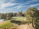 View of golf course and fairway with golfers playing on a sunny day at 5124 N 31St Pl # 536, Phoenix, AZ 85016
