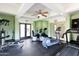 Community gym with ceiling fan, rubber floors, and various exercise machines including a treadmill and elliptical at 5124 N 31St Pl # 536, Phoenix, AZ 85016