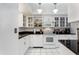 Bright kitchen featuring white cabinets, granite countertops, and modern appliances at 5124 N 31St Pl # 536, Phoenix, AZ 85016