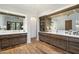 Spacious bathroom with dual vanities, wood cabinets, quartz counters, and stylish lighting fixtures at 5241 E Palo Verde Dr, Paradise Valley, AZ 85253