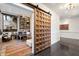 Home office featuring a large sliding barn door, built-in bookshelves, and abundant workspace at 5241 E Palo Verde Dr, Paradise Valley, AZ 85253