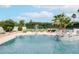 Lush backyard with a pristine pool, palm trees, and a play area, perfect for outdoor enjoyment at 5532 E Crocus Dr, Scottsdale, AZ 85254