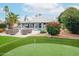 Spacious backyard with outdoor seating and a lush green lawn offers a relaxing and inviting atmosphere at 5532 E Crocus Dr, Scottsdale, AZ 85254