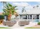 A tranquil backyard offers a pool, lounge seating, and lush greenery for serene outdoor living at 5532 E Crocus Dr, Scottsdale, AZ 85254
