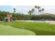 Expansive backyard features a play structure, mini-golf, and a basketball court, ideal for Gathering fun at 5532 E Crocus Dr, Scottsdale, AZ 85254