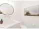Bright bathroom featuring white marble countertop with a vessel sink, gold hardware, and wall art at 5532 E Crocus Dr, Scottsdale, AZ 85254
