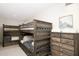 Spacious bunk room featuring two sets of bunk beds, a large dresser, and neutral paint colors at 5532 E Crocus Dr, Scottsdale, AZ 85254