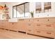 Contemporary kitchen with custom cabinets, a white farmhouse sink, and modern fixtures at 5532 E Crocus Dr, Scottsdale, AZ 85254