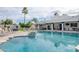 Expansive pool featuring a cascading water feature, elegant lounge chairs, and a relaxing hot tub, set against a backdrop of a modern patio at 5532 E Crocus Dr, Scottsdale, AZ 85254