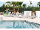 Elegant lounge chairs lining the pool, offering a perfect spot to bask in the sun and enjoy the tranquility of the outdoors at 5532 E Crocus Dr, Scottsdale, AZ 85254