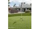 A vibrant putting green, complete with manicured grass, ideal for practicing your golf skills and enjoying outdoor recreation at 5532 E Crocus Dr, Scottsdale, AZ 85254