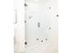 Bright and modern tiled shower with a glass door and a built-in shower niche for storage at 5532 E Crocus Dr, Scottsdale, AZ 85254
