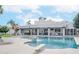 Beautiful swimming pool with diving board and lounge chairs, set against the backdrop of a modern home at 5532 E Crocus Dr, Scottsdale, AZ 85254
