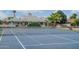 Full tennis court featuring a meticulously maintained blue surface and well-kept surroundings at 5532 E Crocus Dr, Scottsdale, AZ 85254