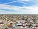 Expansive aerial view of a single-Gathering home with a pool in a suburban neighborhood under a bright blue sky at 6123 W Karen Lee Ln, Glendale, AZ 85306