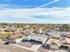 Beautiful aerial view of a neighborhood featuring well-maintained homes and a sparkling community pool at 6123 W Karen Lee Ln, Glendale, AZ 85306