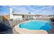 Large backyard featuring a fenced pool, a covered patio, and well-maintained landscaping at 6123 W Karen Lee Ln, Glendale, AZ 85306