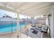 Relaxing backyard patio featuring comfortable seating, a pool, and outdoor lighting at 6123 W Karen Lee Ln, Glendale, AZ 85306