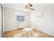 Playful bedroom featuring a small table with chairs, a dresser, and a ceiling fan at 6123 W Karen Lee Ln, Glendale, AZ 85306