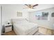 Main bedroom featuring a soft bed, side tables with lamps, and a window, creating a relaxing retreat at 6123 W Karen Lee Ln, Glendale, AZ 85306