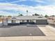 Charming single-story home featuring a spacious front yard with desert landscaping and a two-car garage at 6123 W Karen Lee Ln, Glendale, AZ 85306