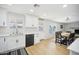 Well-lit kitchen featuring white cabinetry and countertops that flows into a dining area perfect for gatherings at 6123 W Karen Lee Ln, Glendale, AZ 85306