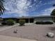 Charming home featuring a well-manicured front yard with desert landscaping and a walkway to the entrance at 6132 E Decatur St, Mesa, AZ 85205