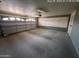 A spacious garage with a functional door and ample room for storage and parking at 6132 E Decatur St, Mesa, AZ 85205