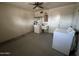 Spacious laundry room features a utility sink, washer, and dryer at 6132 E Decatur St, Mesa, AZ 85205