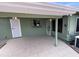 A covered patio includes tile flooring and a security door leading to the backyard at 6132 E Decatur St, Mesa, AZ 85205