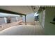 The covered patio features tile flooring and leads to a gravel backyard with shed at 6132 E Decatur St, Mesa, AZ 85205