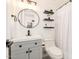 This bathroom features modern lighting, sleek fixtures, and decorative shelving at 623 W Guadalupe Rd # 228, Mesa, AZ 85210
