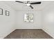 Well lit bedroom features a ceiling fan, carpet, fresh paint, and a bright window at 623 W Guadalupe Rd # 228, Mesa, AZ 85210
