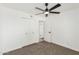 This bedroom is bright and features a ceiling fan, large closet and neutral carpet at 623 W Guadalupe Rd # 228, Mesa, AZ 85210