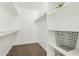 Walk in closet with installed racks and shelves providing ample storage space at 623 W Guadalupe Rd # 228, Mesa, AZ 85210