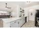 This gorgeous kitchen boasts a quartz countertop island, pendant lights, and stainless steel appliances at 623 W Guadalupe Rd # 228, Mesa, AZ 85210