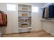 Spacious walk-in closet with built-in shelving units for storage and organization at 634 N Vine St, Chandler, AZ 85225